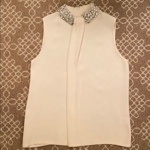 Cream top with jeweled collar